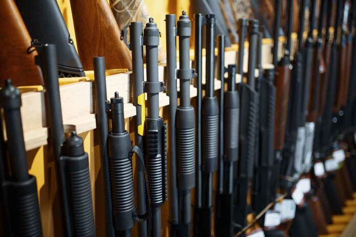 Rifles and shotguns displayed on a rack.