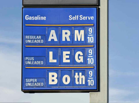 Gasoline price sign with humorous mode of payment.