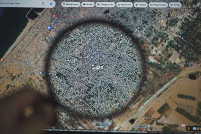 2372300801 featured image Magnifying glass over map of Gaza on a screen.