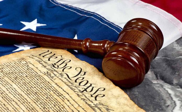 497639149 featured image Gavel and Constitution on American flag background.