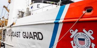 U.S. Coast Guard ship docked at port.