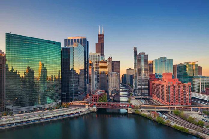 Skyscrapers along a river at sunset.