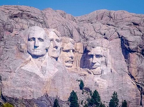 Distant view of Mount Rushmore featuring the carved faces of four U.S. presidents