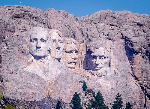 Distant view of Mount Rushmore featuring the carved faces of four U.S. presidents