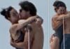 A couple embracing and kissing outdoors