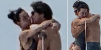 A couple embracing and kissing outdoors