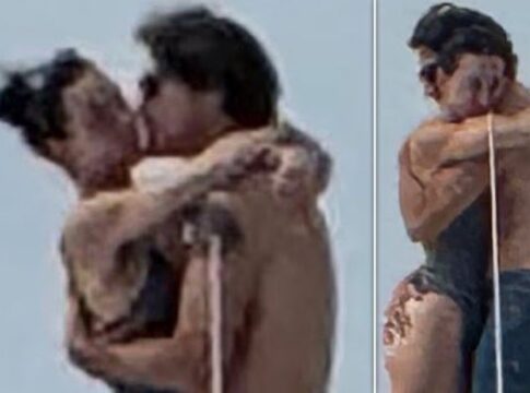 A couple embracing and kissing outdoors