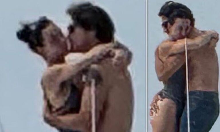 A couple embracing and kissing outdoors