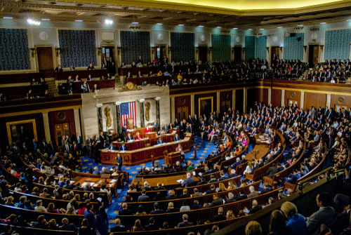 Congressional meeting in session with members seated in chambers.