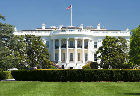 shutterstock147037244-1jpg The White House with the American flag above it.