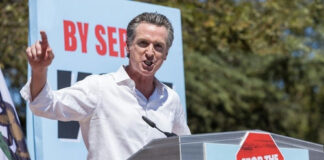 Gavin Newsom speaking at a podium, "Stop the Republican Recall."