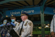 Police officers giving a statement at Union Square station.