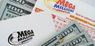 Mega Millions tickets next to $100 bills.