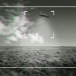 Black and white footage of UFO over a field.