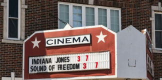 Cinema marquee displaying "Indiana Jones" and "Sound of Freedom".