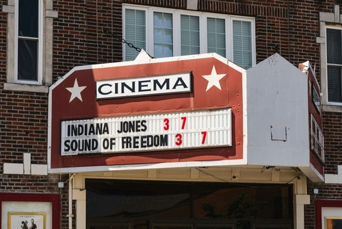 Cinema marquee displaying "Indiana Jones" and "Sound of Freedom".