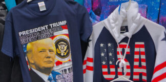 Trump T-shirt and USA hoodie display in store.