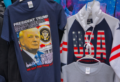 Trump T-shirt and USA hoodie display in store.