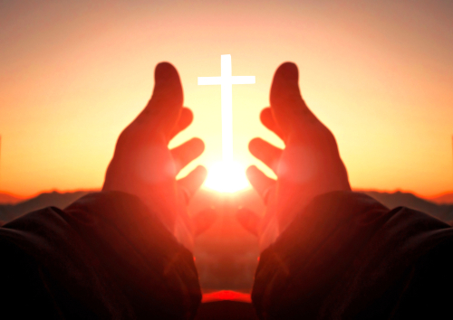 shutterstock_1209744676.jpg featured image Hands reaching toward sun and cross at sunrise.