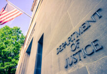 Department of Justice building with American flag.