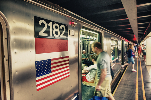 shutterstock_145573753.jpg featured image A busy subway platform with a train pulling in.