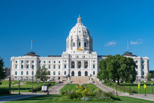 shutterstock_1547356517.jpg featured image White domed building under a clear blue sky.