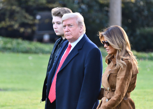 shutterstock_1572261610 (1).jpg featured image Donald Trump with wife Melania and son Barron walking together.