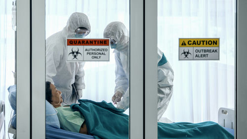 shutterstock_1647350797.jpg Patients and healthcare workers inside a quarantine zone.