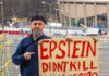 Man holding sign
