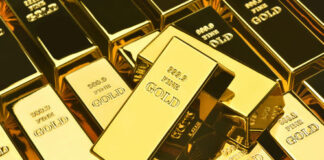 A collection of gold bars stacked together, showcasing their shiny surfaces