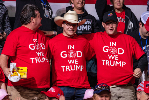 Three men wearing In God We Trump shirts.