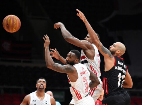 Basketball players competing for the ball during a game