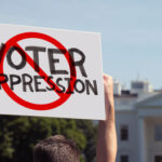 Protest sign against voter suppression near the White House.