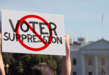 Protest sign against voter suppression near the White House.