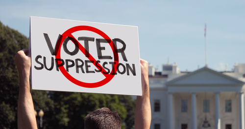 Protest sign against voter suppression near the White House.