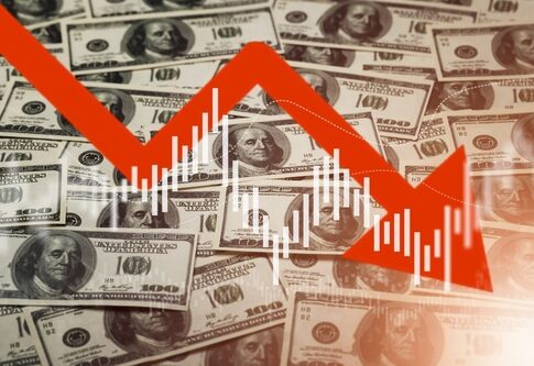 Falling stock market chart overlaying US dollar bills.