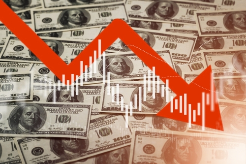 shutterstock_2164573031.jpg featured image Falling stock market chart overlaying US dollar bills.