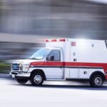 Ambulance speeding on a road