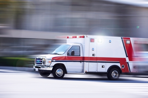 shutterstock_2165835097.jpg featured image Ambulance speeding on a road
