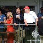 Group of people at Trump National Golf Course event.