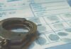 Handcuffs on a fingerprint form document.