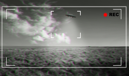 shutterstock_2300957043 (1).jpg featured image Black and white footage of UFO over a field.