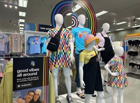 Pride-themed clothing display at a retail store.