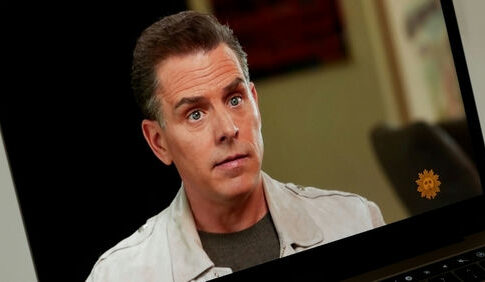 Man in a beige jacket looking at the camera.