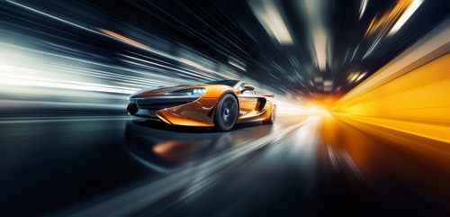 shutterstock_2340654205.jpg featured image Orange sports car speeding through a futuristic tunnel.