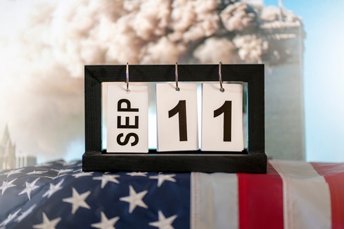 Calendar showing September 11 with American flag background.