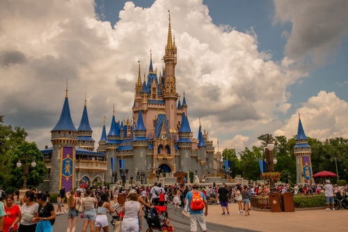 shutterstock_2349709889.jpg featured image Crowd at Magic Kingdom's Cinderella Castle on a cloudy day.