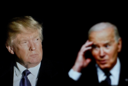 shutterstock_2448480487.jpg featured image Donald Trump and Joe Biden in dark background.