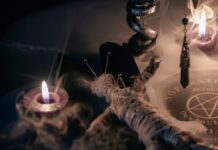 A dark, mystical scene featuring candles, a voodoo doll, and occult symbols
