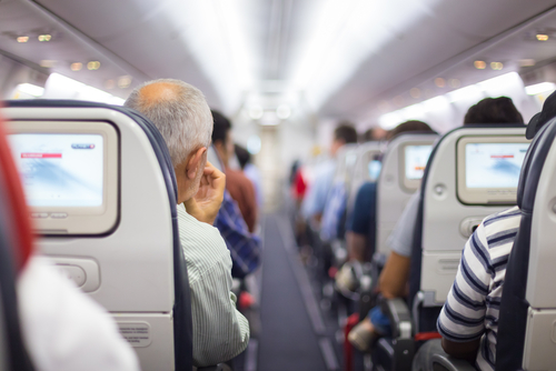 shutterstock_256478011.jpg featured image People seated inside an airplane cabin.